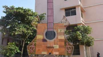 Students create 70-feet-tall guitar out of trash