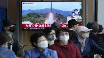 A TV screen shows a file image of North Korea's missile launch during a news program at the Seoul Railway Station in Seoul, South Korea on Oct. 14, 2022. 