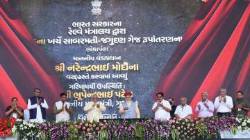 Prime Minister Narendra Modi with Gujarat CM Bhupendra Patel and other officials in Modhera 