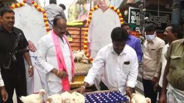 Visuals of the TRS leader distributing free liquor and chicken