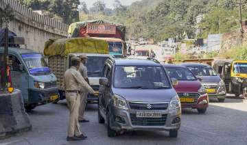 Assam Police personnel stop Meghalaya-bound vehicles for safety reasons