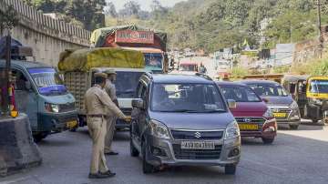 Assam Police personnel stop Meghalaya-bound vehicles for safety reasons, a day after violence at a disputed Assam-Meghalaya border location that killed six people, in Jorabat. 
