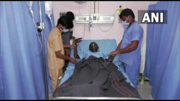 The man after surgery was performed on him to remove 187 coins from his stomach.  