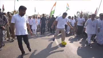 Rahul Gandhi with a football during the padyatra