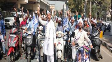 AAP leader Sandeep Bhardwaj (in white kurta payjama).