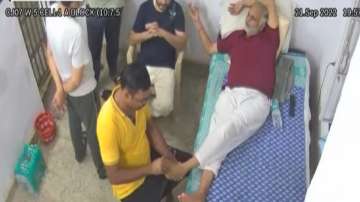 AAP minister Satyendar Jain was seen taking a massage inside Delhi jail in a video which went viral on social media 