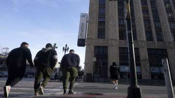 People walk outside Twitter headquarters in San Francisco.