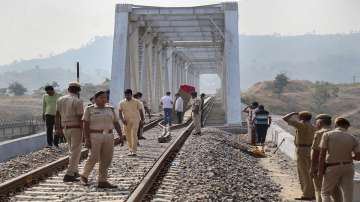 Police personnel investigate after an explosion on Udaipur-Ahmedabad railway track in Udaipur.