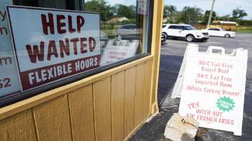 A help wanted sign is displayed in Deerfield, Ill., Wednesday, Sept. 21, 2022. 