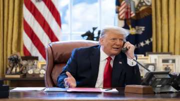 Ex-US President Donald Trump talks on the phone to Vice President Mike Pence.