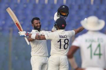 Pujara celebrated his 19th Test ton with Virat Kohli on the field.