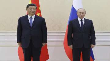 Chinese President Xi Jinping, left, and Russian President Vladimir Putin pose for a photo on the sidelines of the Shanghai Cooperation Organisation (SCO) summit in Samarkand.