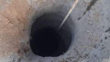 The child is stuck at the depth of around 60 feet in the borewell