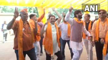 BJP workers danced in joy as the saffron camp went into a festive mood as trends reflected the BJP was all set to return to power for the record seventh term in Gujarat.