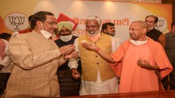 Uttar Pradesh Chief Minister Yogi Adityanath, Dy CM Dinesh Sharma (Left) and UP BJP President Swatantra Dev Singh (Centre)