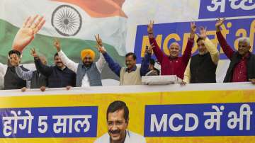 Delhi Chief Minister and Aam Aadmi Party (AAP) convener Arvind Kejriwal with Punjab CM Bhagwant Mann, Delhi Deputy CM Manish Sisodia, Delhi Environment Minister Gopal Rai and other leaders during celebrations after AAP crossed the majority mark in the MCD polls, at the party headquarters in Delhi. 