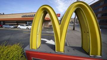 A McDonalds' logo displays outside its restaurant.