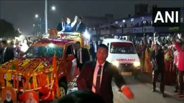 PM Modi convoy stops, pm modi make way for ambulance, Ahmedabad roadshow, modi live, bjp logo, live 