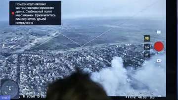 A Ukrainian soldier watches a drone feed from an underground command centre in Bakhmut.