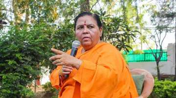 Senior BJP leader Uma Bharti addresses a press conference at her residence in Bhopal.

