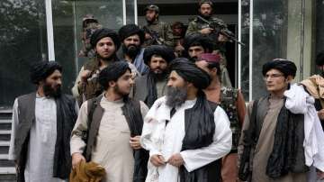  Mullah Abdul Ghani Baradar, acting deputy prime minister of the Afghan Taliban's caretaker government, center, and other Taliban officials attend a ceremony marking the 9th anniversary of the death of Mullah Mohammad Omar, the late leader and founder of the Taliban