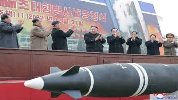 North Korean leader Kim Jong Un, centre, attends a ceremony of donating 600mm super-large multiple-launch rocket system at a garden of the Workers’ Party of Korea headquarters in Pyongyang.