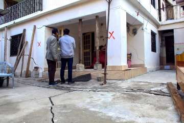 A building marked unsafe after appearance of cracks due to land subsidence, in Joshimath