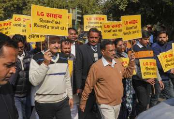 Delhi Chief Minister Arvind Kejriwal with Deputy Chief Minister Manish Sisodia and other AAP MLAs during a protest march towards Delhi Lieutenant Governor VK Saxenas office over his alleged interference in the working of the city government