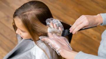 Representative image of a woman getting hair treatment at salon