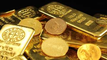 Dollar edged up from eight-month lows and gold remains stable