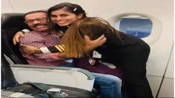 Pilot wins hearts by touching her father's feet before take-off.