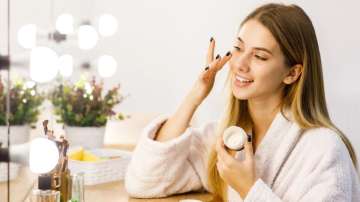Representative image of a woman applying face cream