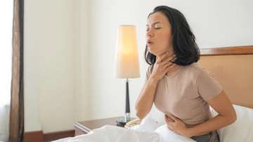 Representative image of a woman suffering from sore throat