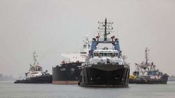 Tugboats pull a ship in the Suez Canal between the cities of Port Said and Ismailiya, Egypt (Representational image)