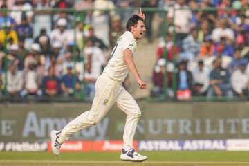 Pat Cummins celebrates after taking a wicket