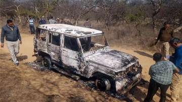 Charred remains of a vehicle where bodies of two Muslim men were found, at Loharu in Bhiwani district

