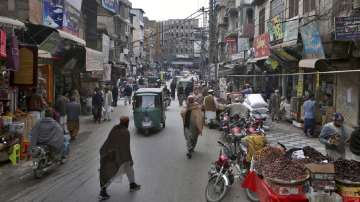 People visit a market in the old area of Peshawar, Pakistan.