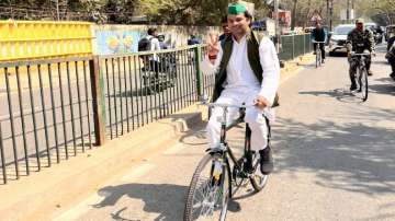 Bihar Environment minister Tej Pratap Yadav rides a bicycle to his office
