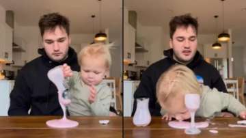 Uncle teaches nephew how to pour drink