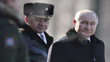 Russian President Vladimir Putin, right, and Russian Defence Minister Sergei Shoigu