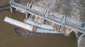 Two barges are stuck against the dam just south of downtown Louisville, Ky.
