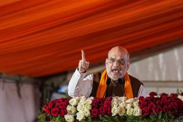 Union Home Minister Amit Shah speaks during the launch the Vijay Sankalp Yatra and public meeting at Devanahalli near Bengaluru. 