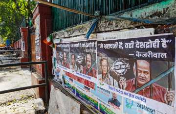 Posters of AAP leaders Manish Sisodia and Satyendar Jain put up