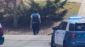 Amazon delivery agent delivers package during SWAT operation