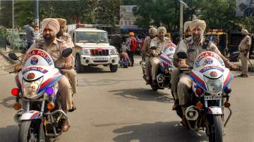 Punjab Police personnel conduct a flag march amid a crackdown against Waris Punjab De chief Amritpal Singh and his aides, in Patiala.