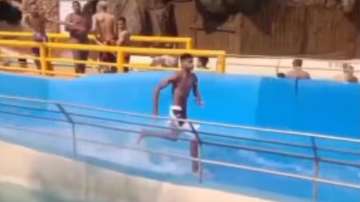 Man runs on waterslide