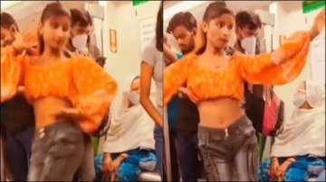 Girl makes dance reel inside Delhi Metro