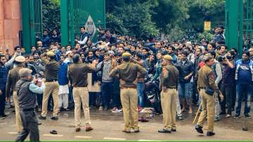 Students of Jamia Millia Islamia University clash with the police during a protest against the Citizenship Amendment Bill (CAB), at the University in New Delhi, Friday, Dec. 13, 2019.