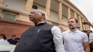 Congress President Mallikarjun Kharge with party leader Rahul Gandhi and other opposition MPs during a protest over the Adani issue at Parliament House complex, in New Delhi.