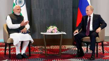 Russian President Vladimir Putin, right, listens to Prime Minister Narendra Modi during their talks on the sidelines of the Shanghai Cooperation Organisation (SCO) summit in Samarkand, Uzbekistan, Sept. 16, 2022. 